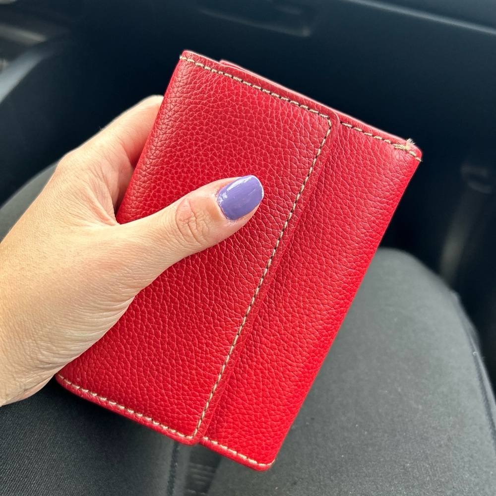 Wallet genuine leather red color with 10 card holders w/ zipper compartment.